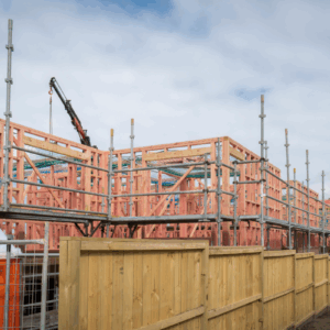 Cranes over Auckland skyline representing active urban development and growth opportunities for property investors