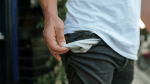 Close-up of a landlord pulling out an empty pocket, symbolising the financial strain of unpaid rent and cashflow pressure.