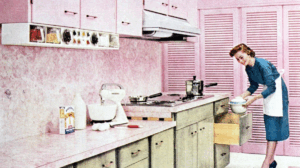 1950s retro kitchen with pink cabinets and a woman in apron baking, illustrating outdated renovation trends